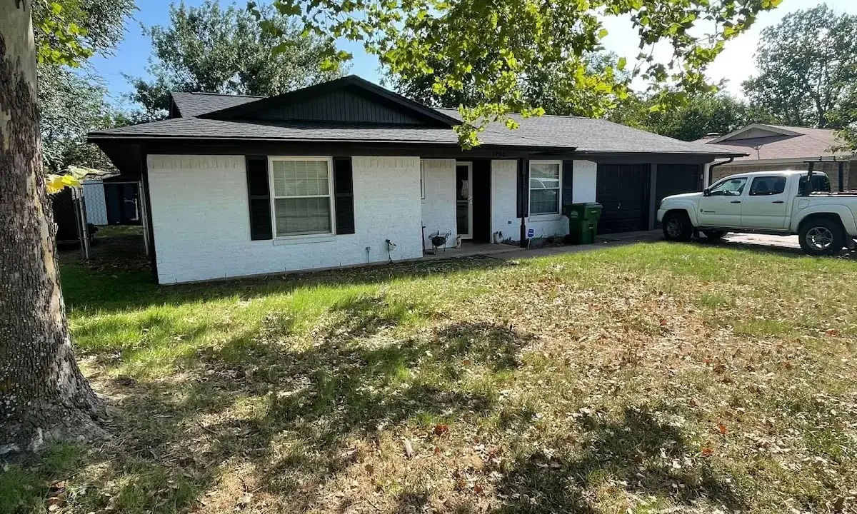 Professional roofing crew working on a residential roof in Elizabeth City